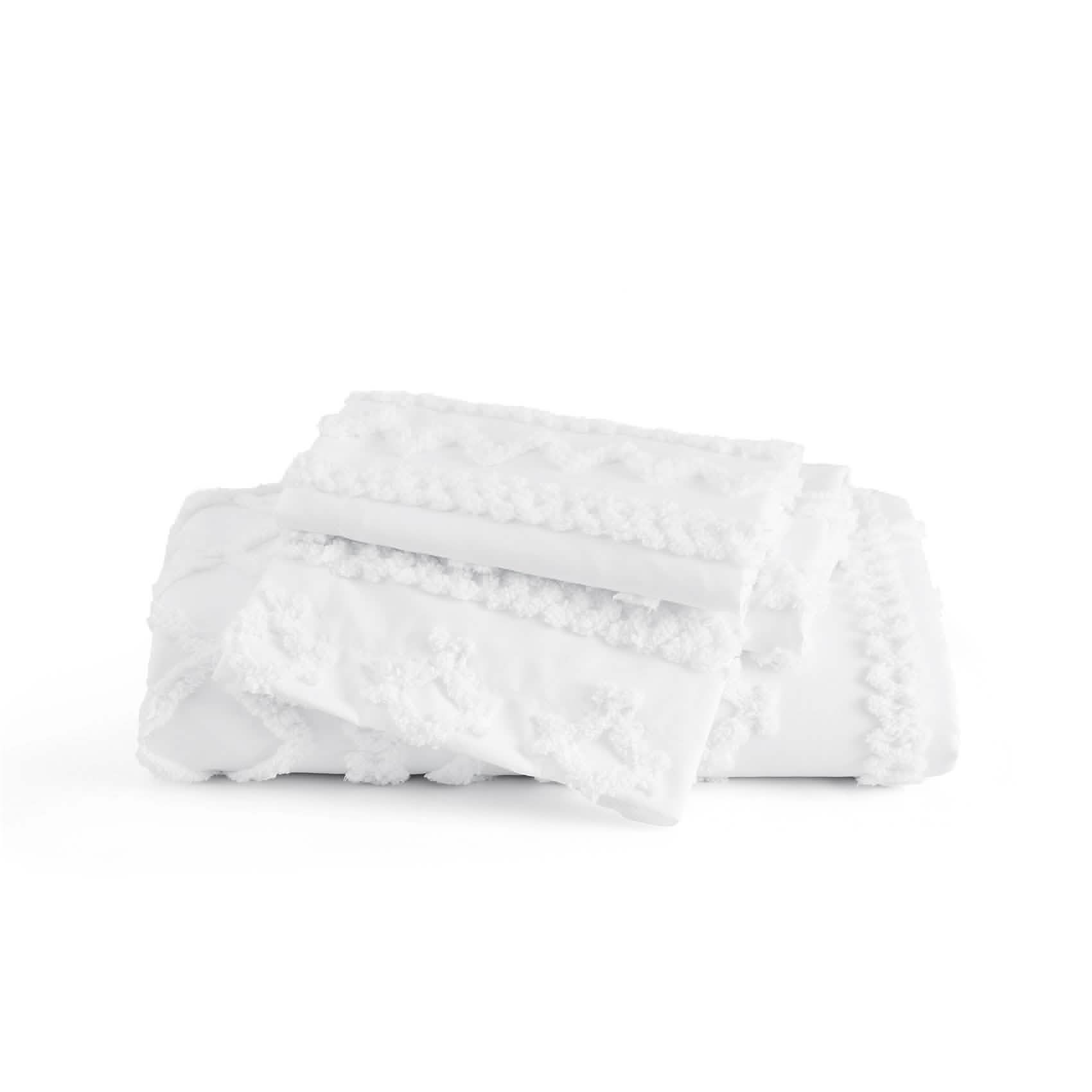 Folded white blanket on a white background